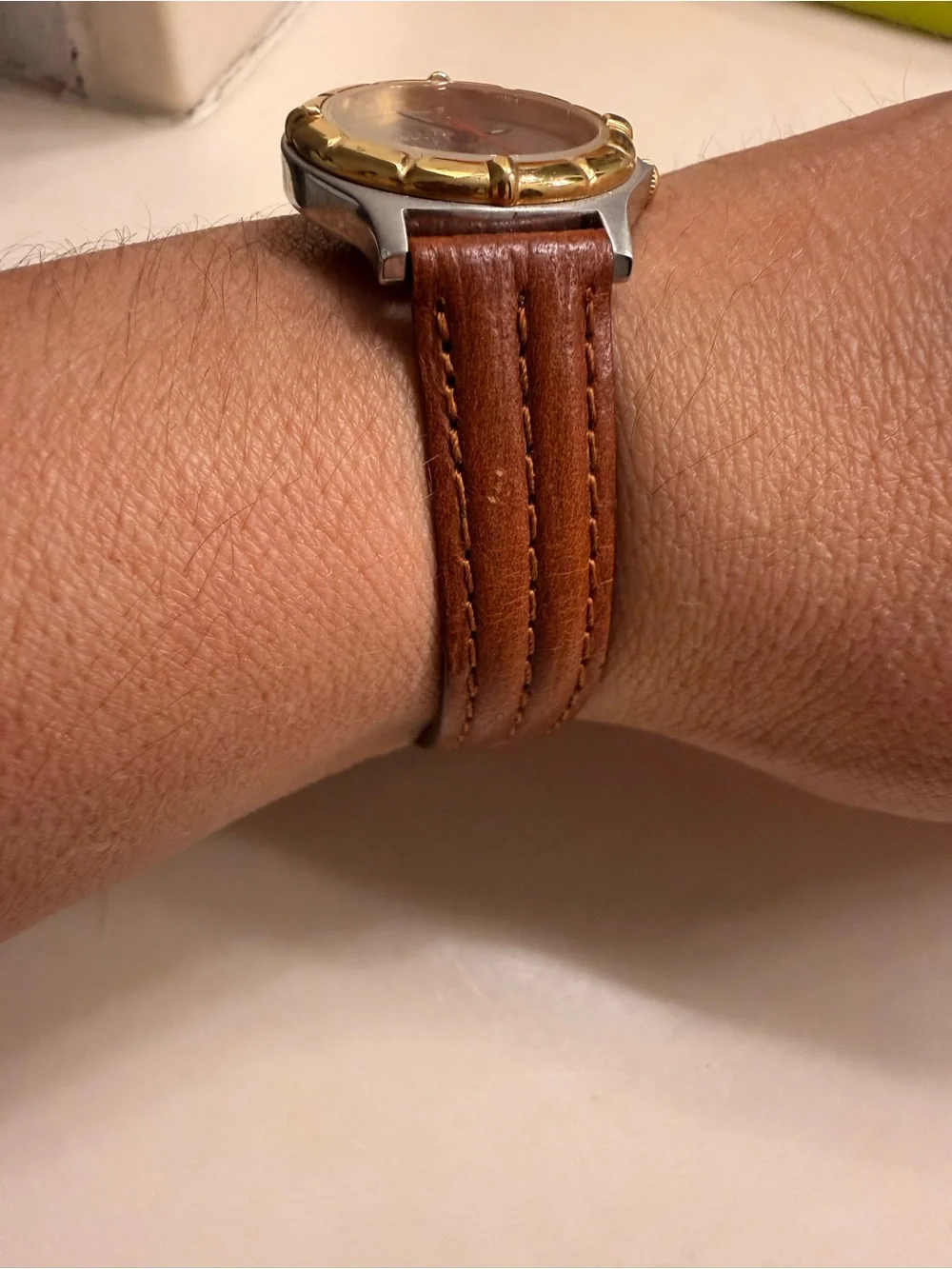 Brown Leather-Strap Watch with Gold-Bezel Accent need battery